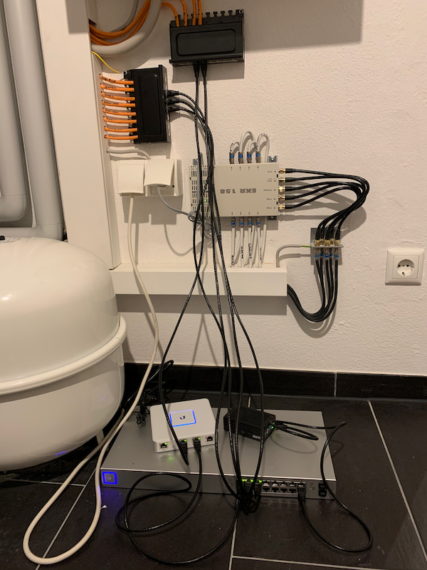 Picture of network cables, Unifi switch, and Unifi security gateway